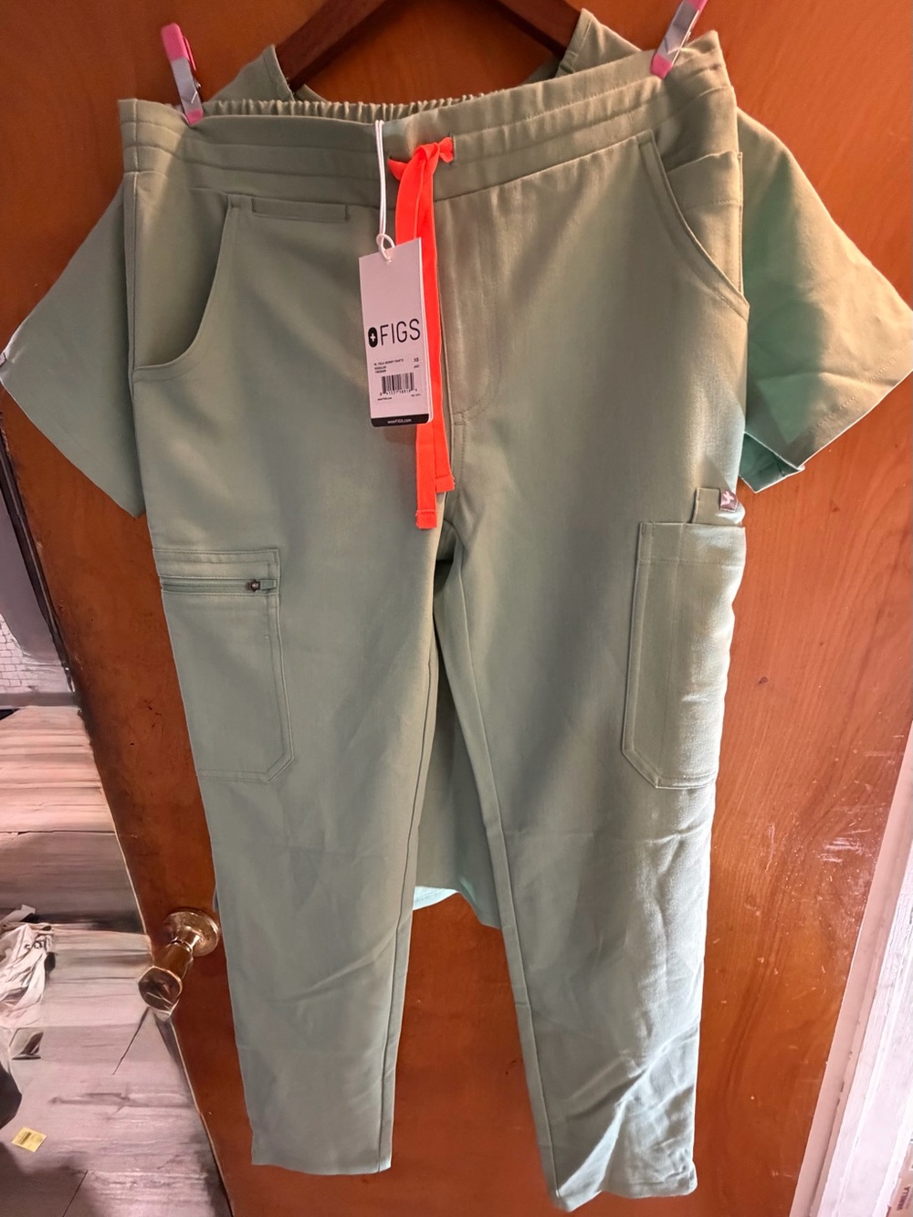 Figs Sage Green Scrub Top with Maroon Logo Tab